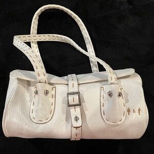 White purse with contrast tan stitching